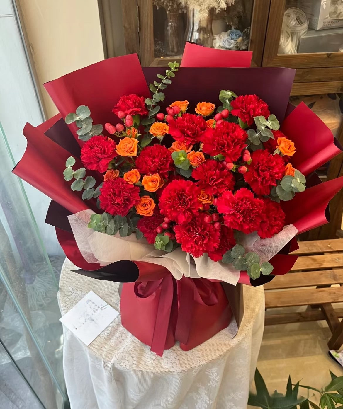 11枝紅色康乃馨橙泡泡混搭鮮花束